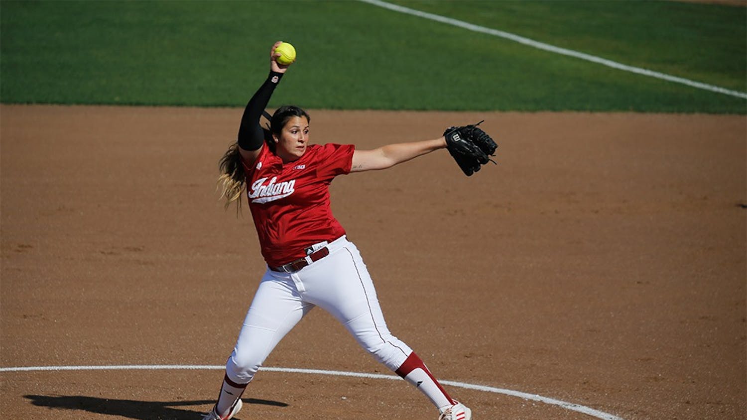 Senior Pitcher Miranda Tamayo winds up for a pitch during IU's first game against Purdue April 22, 2015 at Andy Mohr Field. IU won 6-3 after freshman Mena Fulton hit a 3-run home run during the last inning of the game.
