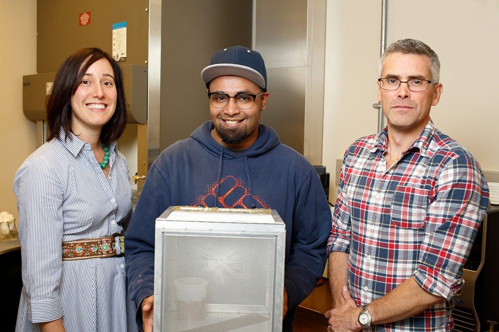 The study authors are, from left, IU assistant professor Irene Garcia Newton, IU Ph.D. student Tamanash Bhattacharya and IU professor Richard Hardy. Bhattacharya holds a container with flies used in the study. (Courtesy Photo of Indiana University)