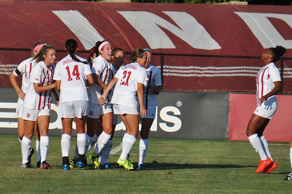 The IU women's soccer team celebrate an early goal in their season-opening game against Louisville on Sept. 24 at Bill Armstrong Stadium.