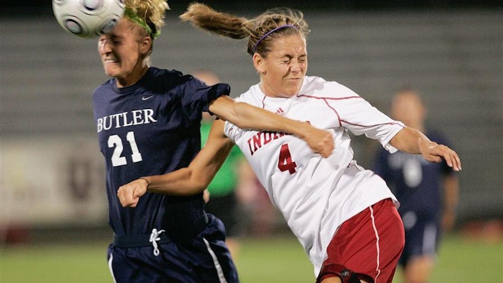 Senior defender Jessica Boots battles Butler's Mandi Kotynski for a header during the first-half of the Hoosiers game against the Bulldogs on Wednesday night at Armstrong Stadium.
