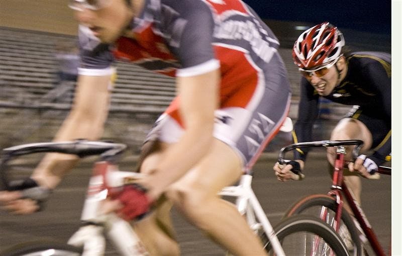  Eric Young of the Cutters, right, passes Matt Neibler of Delta Tau Delta during Individual Time Trials on Wednesday. Young, with a time of 2:18.25, had the fastest time of the evening. 