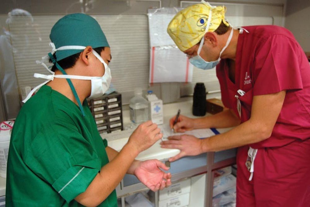 Anthony Anderton • ORBISDr. Dan Neely and Dr. Phara Khauv discuss the critical elements of Thai Phok Phorng's surgery. 