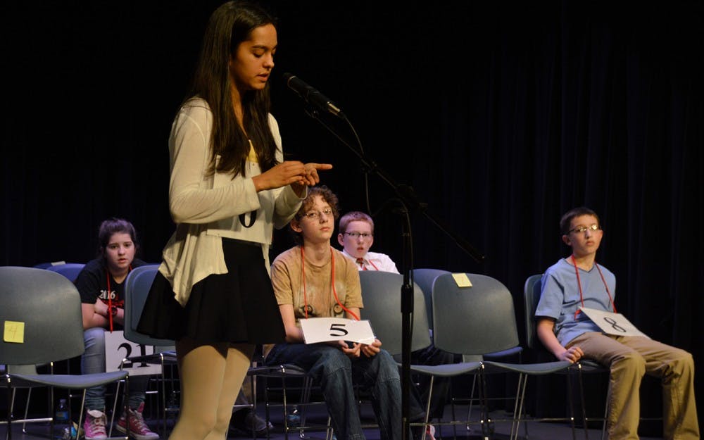Tara Ganguly, the IU Bee runner up, spells an early-round word on her hand. Ganguly, an eighth-grader, was the defending champion.&nbsp;