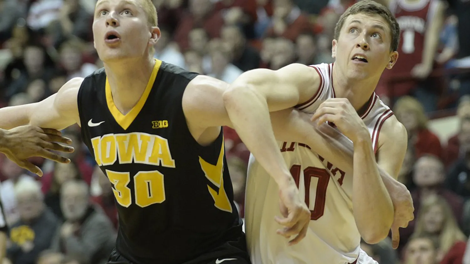 Junior forward Ryan Burton attempts to box out an Iowa defender.