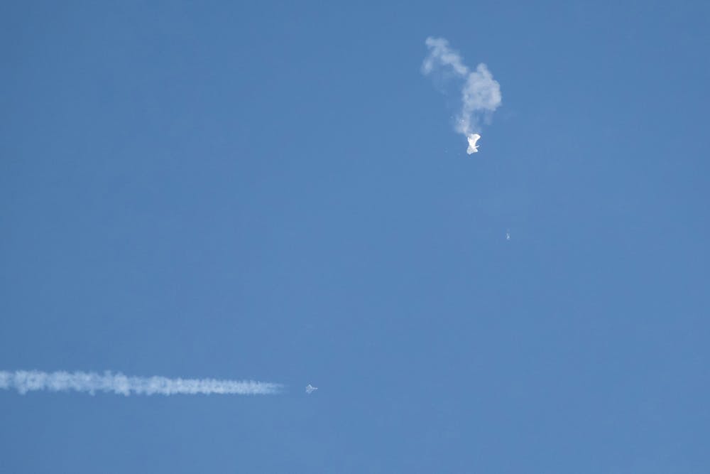 <p>Debris falls from the sky after a Chinese spy balloon was shot down by an F22 military fighter jet on Feb. 4, 2023, over Surfside Beach, South Carolina. The spy balloon has been﻿ in different memes all over social media since it was first discovered.  </p>