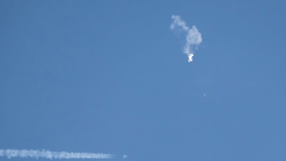 Debris falls from the sky after a Chinese spy balloon was shot down by an F22 military fighter jet on Feb. 4, 2023, over Surfside Beach, South Carolina. The spy balloon has been﻿ in different memes all over social media since it was first discovered.  
