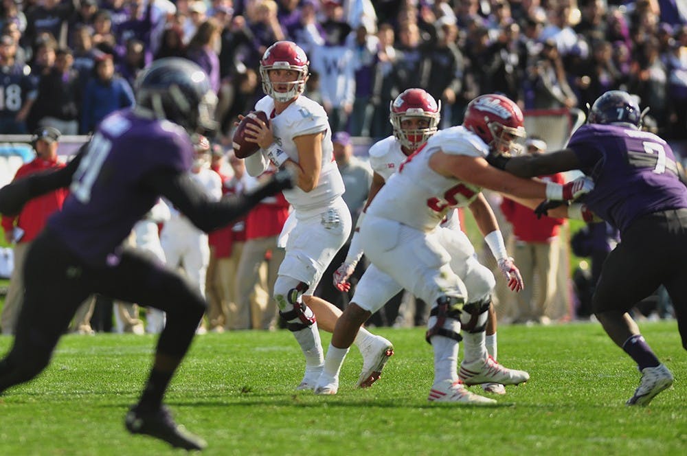 Junior quarterback Richard Lagow looks for an open receiver on Saturday at Ryan Field in Evanston, Ill. Indiana lost to Northwestern 24-14.