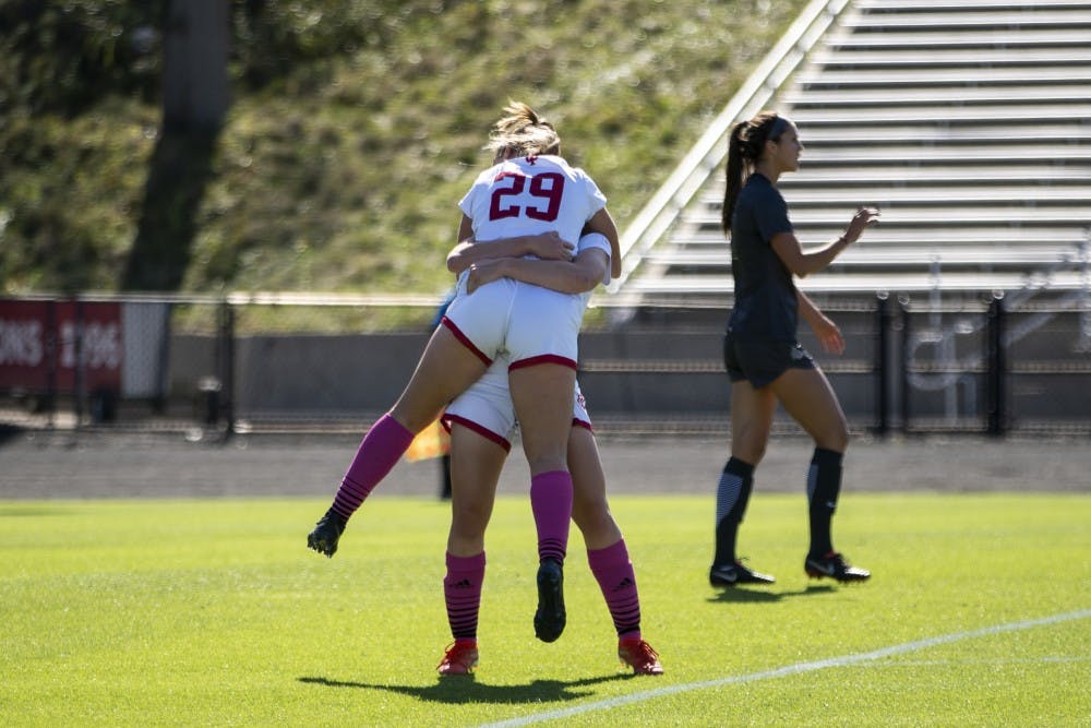 <p>Freshman Alaina Kalin hugs freshman Avery Lockwood after a goal Oct. 13 at Bill Armstrong Stadium. Lockwood passed it to Kalin for her to get a clear shot at the Ohio State goal. </p>