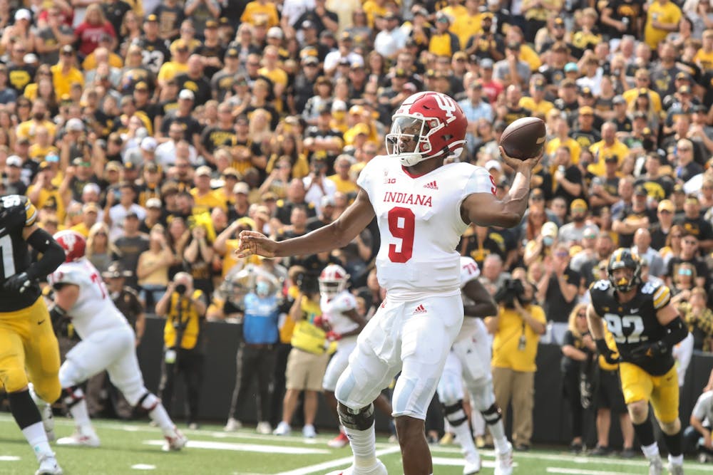 <p>Junior quarterback Michael Penix Jr. looks to make a pass Sept. 4, 2021, in Kinnick Stadium in Iowa City, Iowa. Penix is week to week with an injury to his throwing shoulder, Indiana head coach Tom Allen said in a press conference Monday. </p>