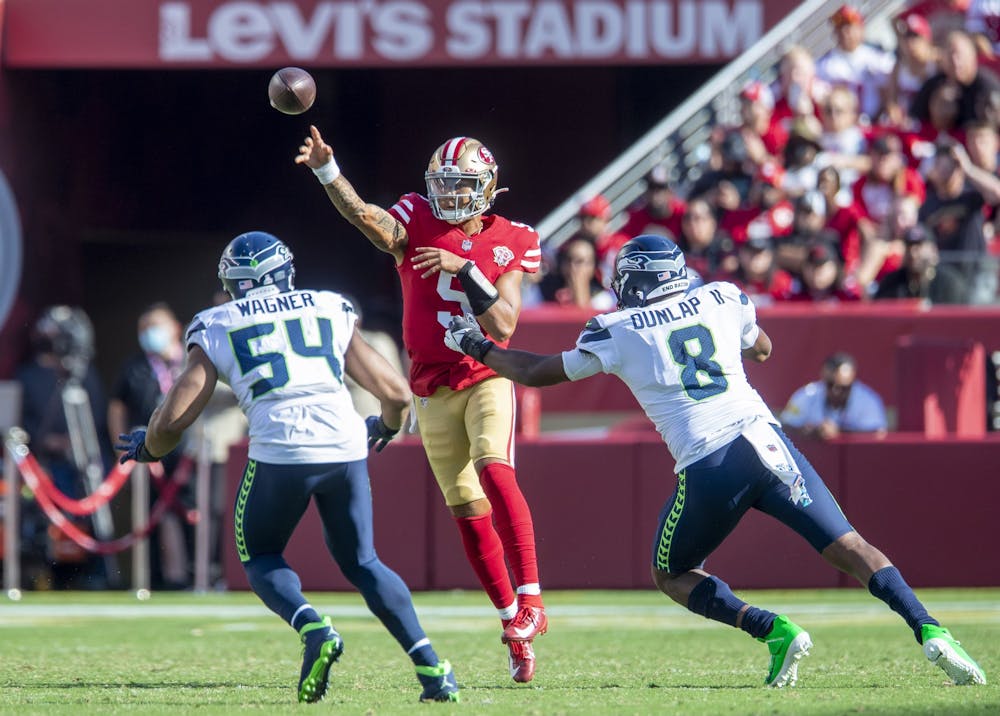 <p>San Francisco 49ers quarterback Trey Lance passes over the rush of Seattle Seahawks&#x27; Bobby Wagner and Carlos Dunlap II﻿ Oct. 3, 2021, at Levi&#x27;s Stadium in Santa Clara, California.</p>