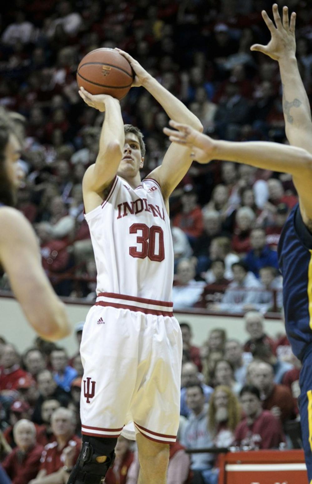 Sophomore forward Collin Hartman goes up for a shot against North Carolina Greensboro on Friday at Assembly Hall. 