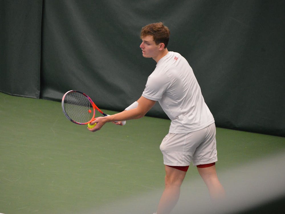 Senior Andrew Redding prepares to serve the ball April 11 at the IU Tennis Center. The IU men&#x27;s tennis team will compete against Wisconsin in the Big Ten Tournament on Thursday in Lincoln, Nebraska. 