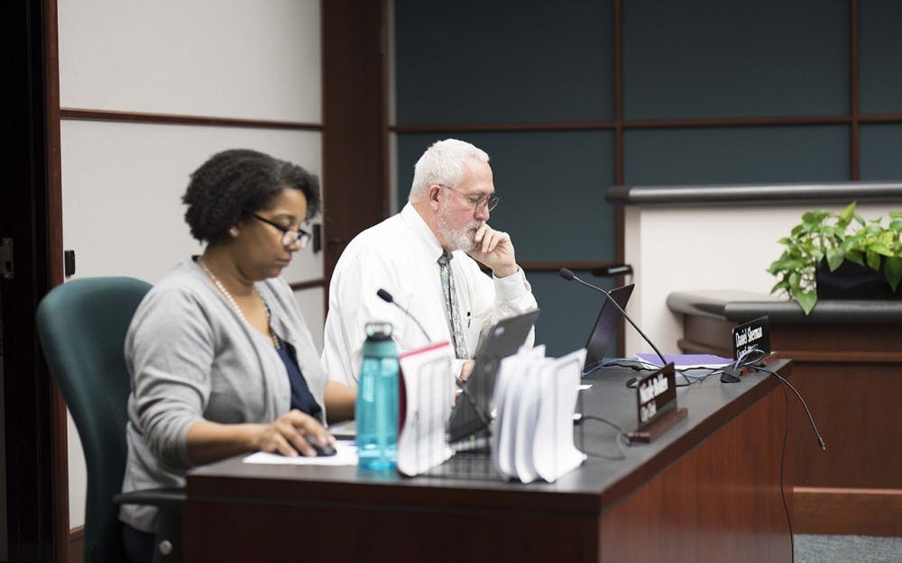 <p>Daniel Sherman, coucil attorney, and Nicole Bolden, city clerk, prepare for the first city council meeting of the year Jan. 11, 2017. The City of Bloomington is launching NextRequest, a new public records management system designed to improve transparency and response time to public records requests.</p>