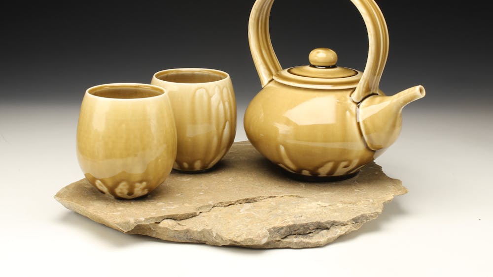 A ceramic clay teapot and cups made by IU alumn Matt Fiske are pictured. Fiske, now based in Sitka, Alaska, will exhibit his series of ceramic vessels at the &quot;Derivations&quot; exhibition opening reception on Aug. 25, 2023.