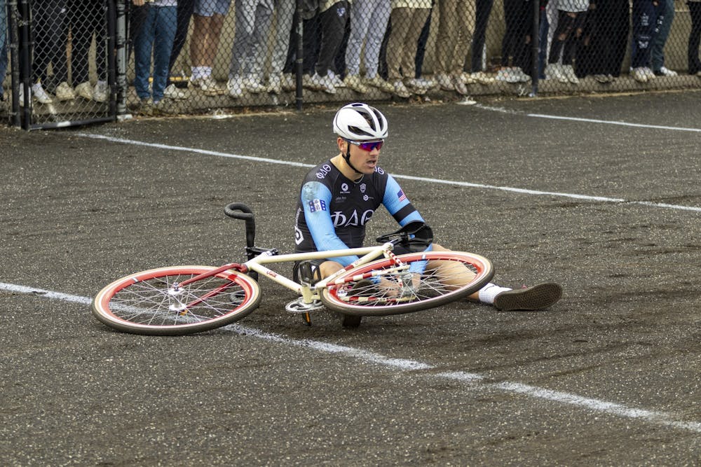 <p>Member of Phi Delta Theta is seen sitting on the track after faulting in the qualifying during IU Little 500 Qualifiers on March 25, 2023 at Bill Armstrong Stadium. Phi Delt boasted last year’s ITTs winner.</p>