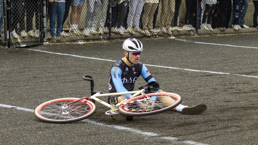 Member of Phi Delta Theta is seen sitting on the track after faulting in the qualifying during IU Little 500 Qualifiers on March 25, 2023 at Bill Armstrong Stadium. Phi Delt boasted last year’s ITTs winner.