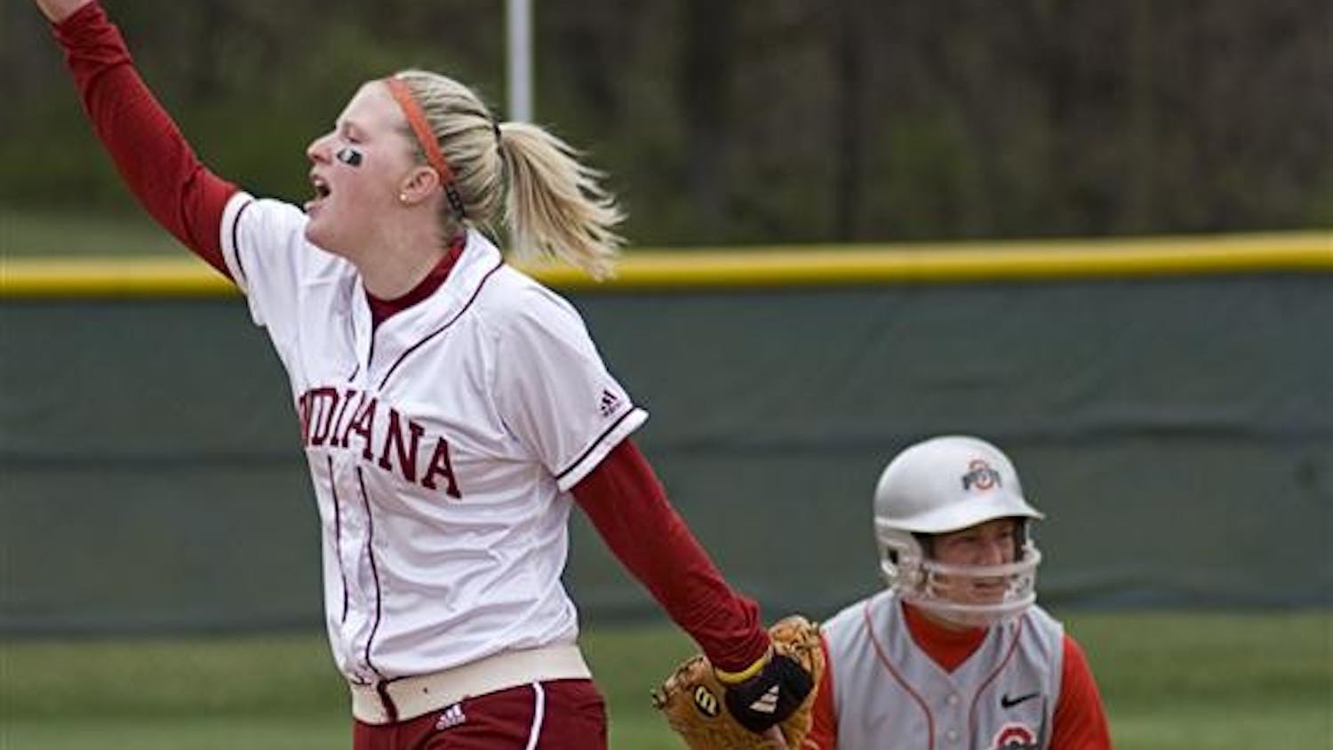 Senior Emily Bergeson yells to her teammates during the first of two games against Ohio State on April 8 at the IU Softball Field. Sophomore Sara Olson pitched a no-hitter in the second game.
