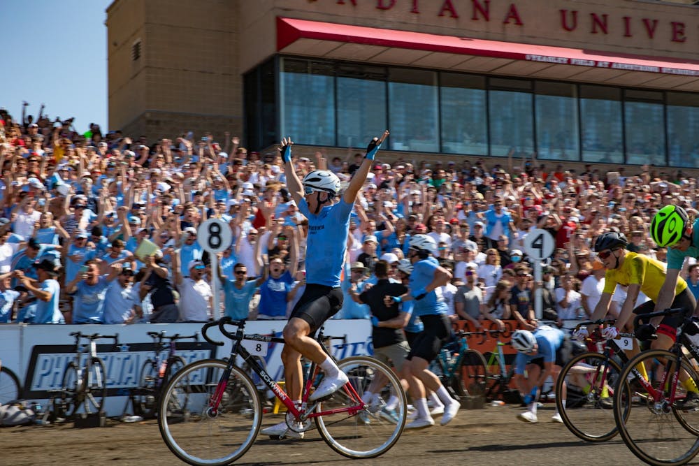 <p>A cyclist from Phi Delta Theta celebrates his win at the 71st Little 500 Men&#x27;s Race on April 23, 2022, at Bill Armstrong Stadium. His team took first place overall. </p>