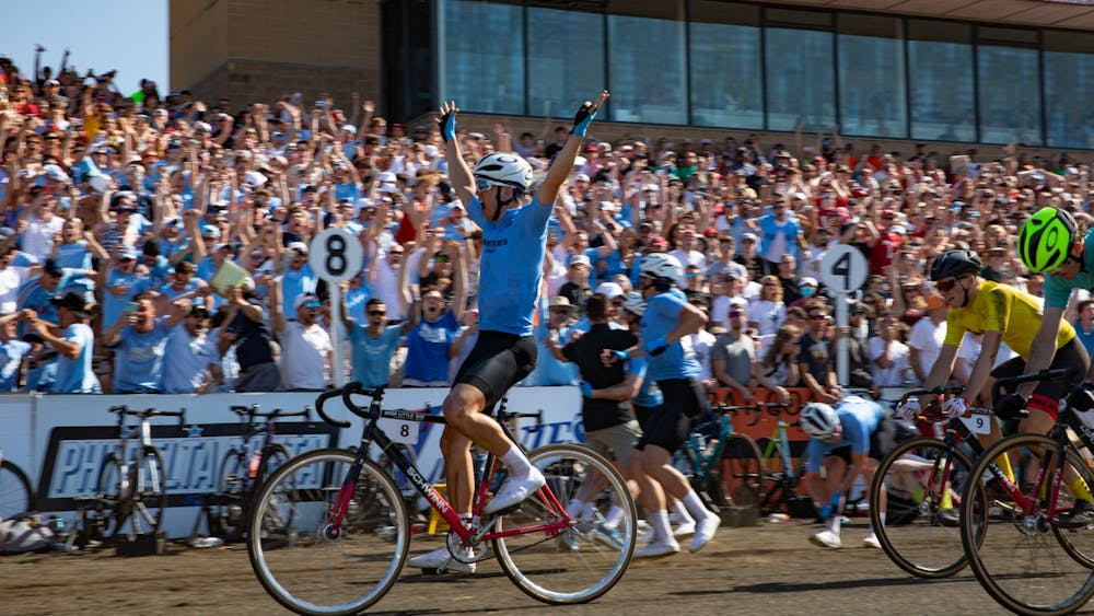 A cyclist from Phi Delta Theta celebrates his win at the 71st Little 500 Men&#x27;s Race on April 23, 2022, at Bill Armstrong Stadium. His team took first place overall. 