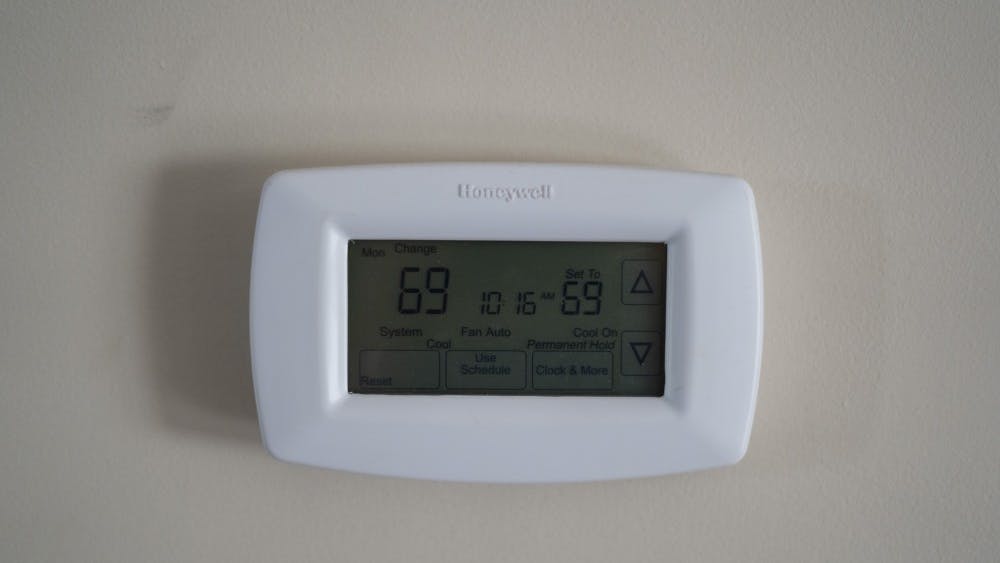 A thermostat displays the temperature Sept. 23 inside a student house. Students often try to find ways of keeping their utility costs down. 
