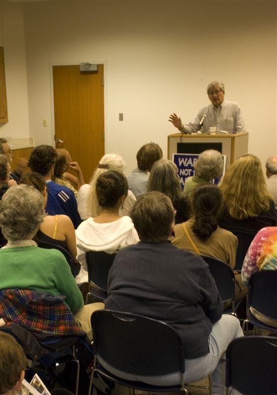 Veterans for Peace President Mike Ferner speaks to Bloomington peace sympathizers Wednesday evening at the Monroe County Public Library.