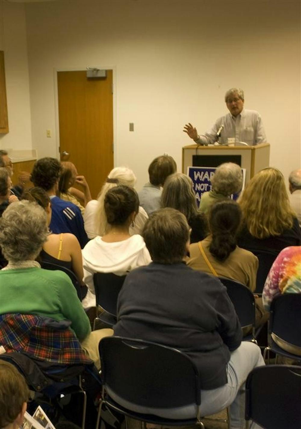 Veterans for Peace President Mike Ferner speaks to Bloomington peace sympathizers Wednesday evening at the Monroe County Public Library.
