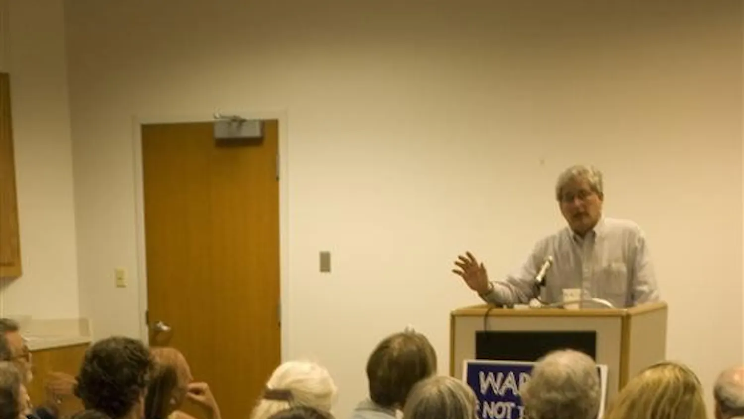 Veterans for Peace President Mike Ferner speaks to Bloomington peace sympathizers Wednesday evening at the Monroe County Public Library.