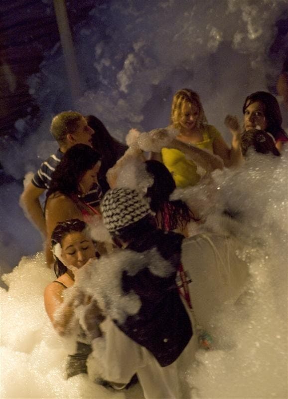 Jay Seawell/Weekend
People dance during the Ibiza Foam Party Sept. 3 at Jake's Nightclub.