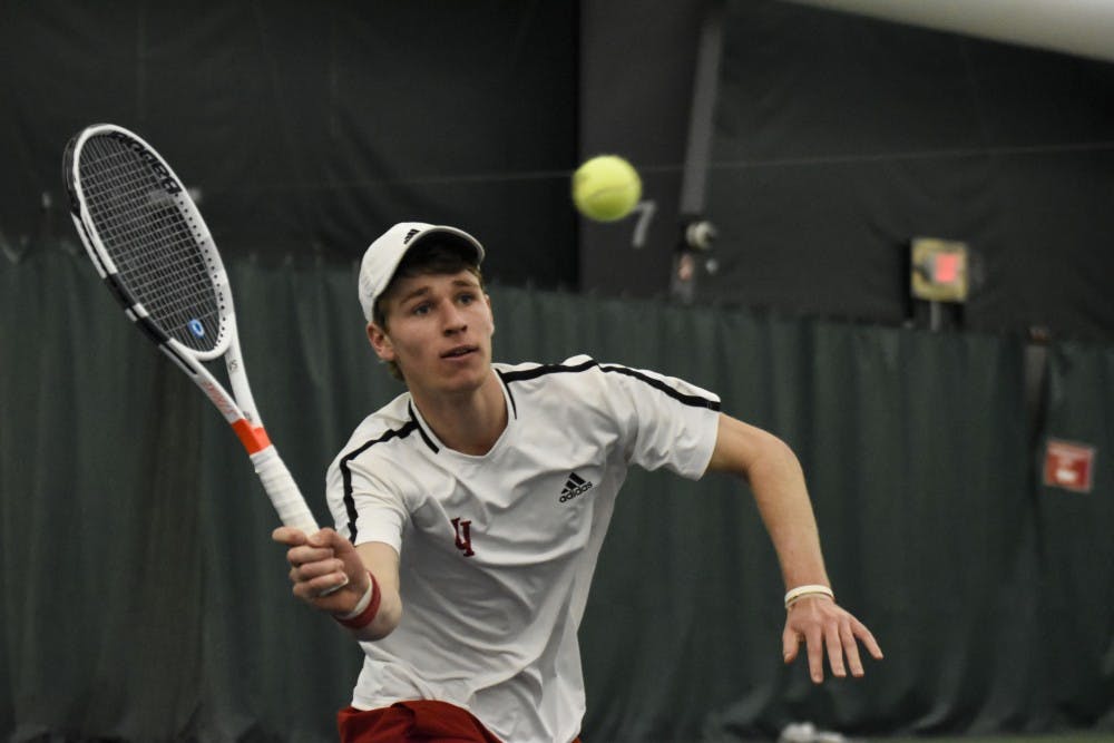 <p>Then-sophomore Bennett Crane reaches for a forehand during his 6-2, 6-7, 4-6 singles loss against Wisconsin last season at the IU Tennis Center. IU men's tennis will take on Drake University and Utah State University this weekend in Des Moines, Iowa.</p>