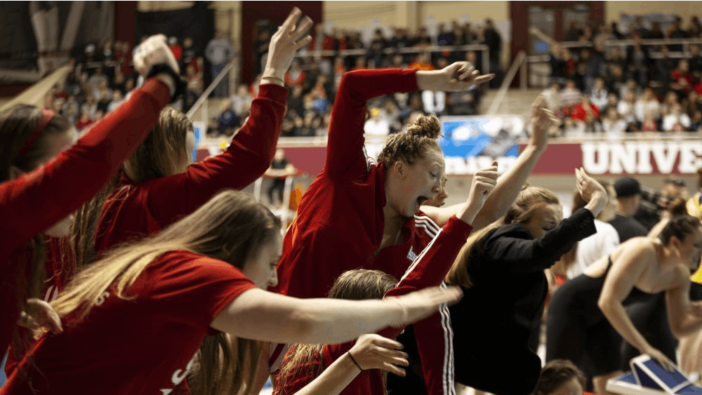 The IU women’s swimming team cheers on a teammate Feb. 23, 2020, in the Counsilman-Billingsley Aquatics Center. Both the men&#x27;s and women&#x27;s swimming and diving teams beat Purdue and Rutgers on Saturday in West Lafayette, Indiana. 