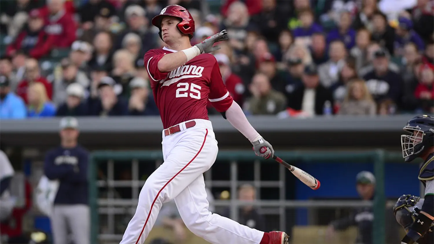 Senior catcher Brad Hartong watches his fly ball during the April 21 game against Notre Dame. The Hoosiers defeated the Fighting Irish 6-5.