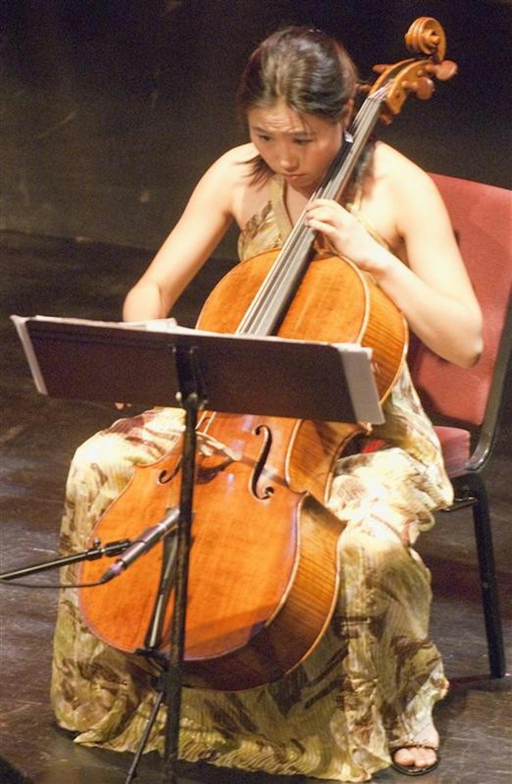 Cellist Jisoo OK, of The Eternal Tango Trio, performs during the Summer Night of Lotus concert Friday evening at the Buskirk-Chumley Theater. The event marked the kick-off to the 2009 Lotus season.