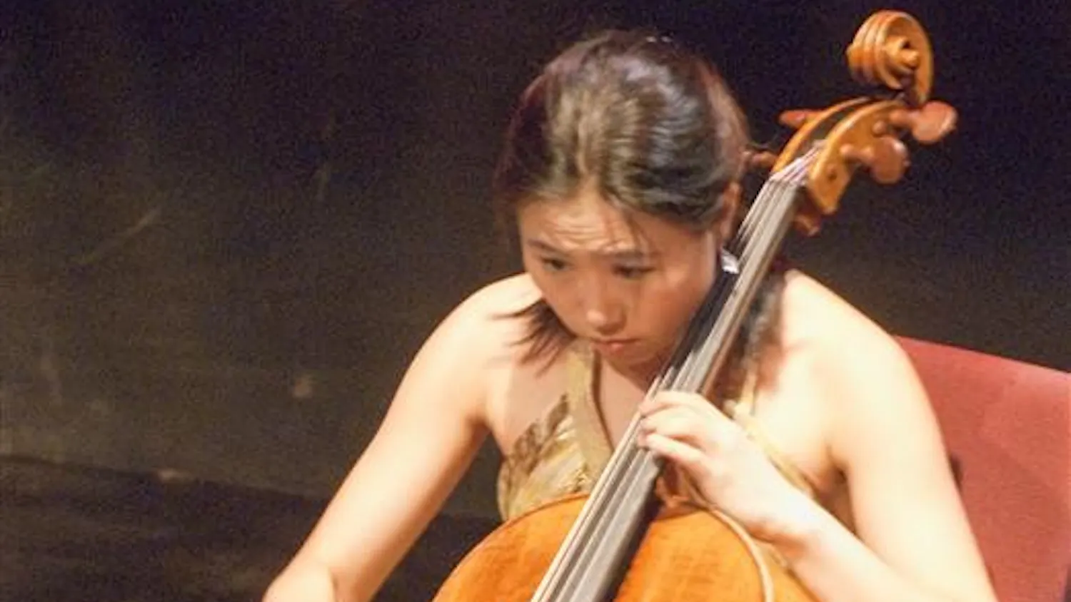 Cellist Jisoo OK, of The Eternal Tango Trio, performs during the Summer Night of Lotus concert Friday evening at the Buskirk-Chumley Theater. The event marked the kick-off to the 2009 Lotus season.