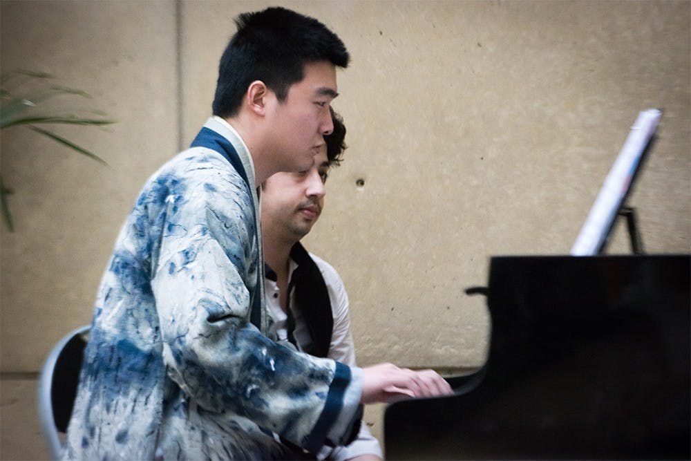 Pianist Yihan Chen performs his voice and piano arrangment, "Vanished Through Time," at the East Meets West concert Sunday at the Art Museum. The concert showcased New Chinese music written for Western instruments. 