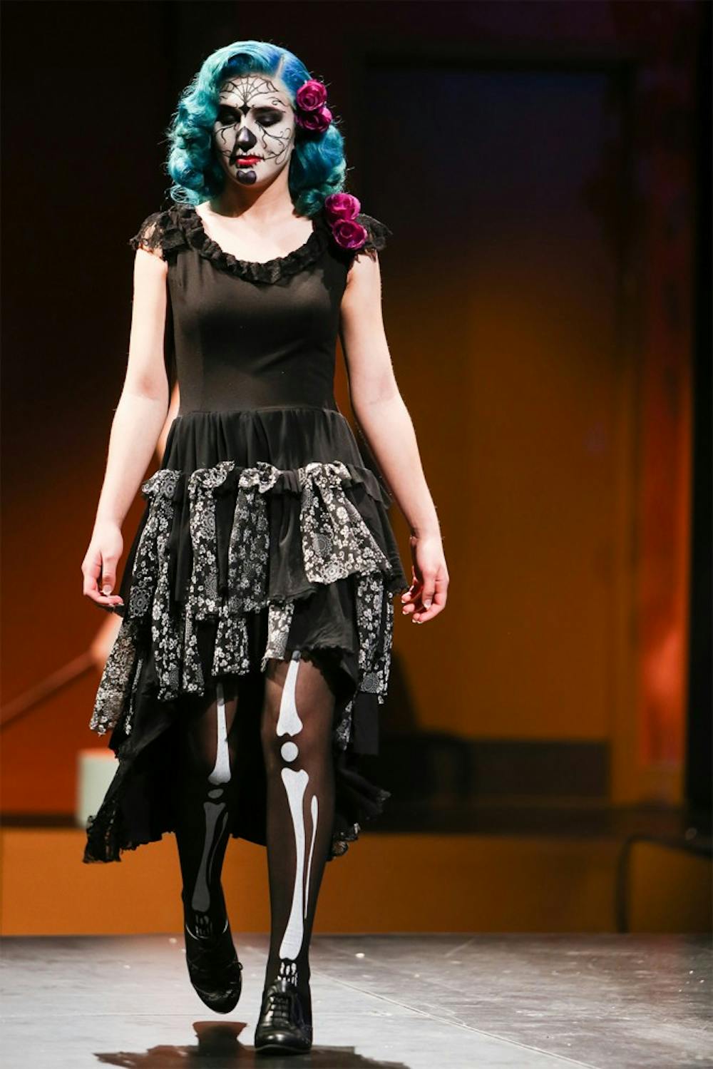 Ivy Richardson walks the stage of the Trashion Refashion Show wearing costume designed by Kelly Richardson on April 26, 2015.