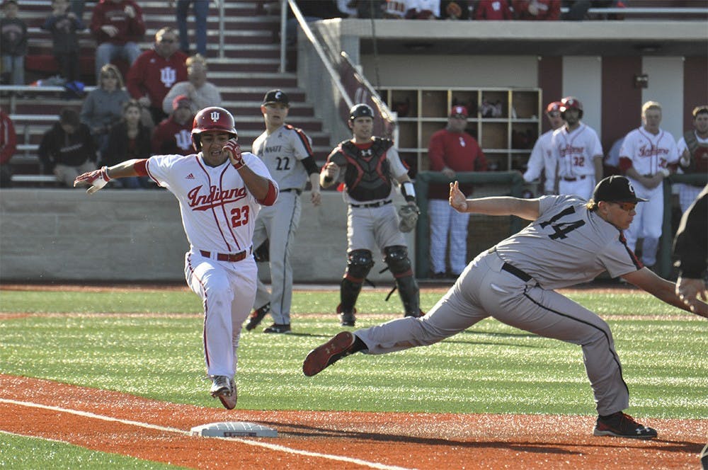 Sophomore outfielder Laren Eustace sprints to first after an error turns a likely out into a double for the Hoosiers on Mar. 29, 2016. The Hoosiers went on to lose to Cincinnati last Tuesday 5-0.
