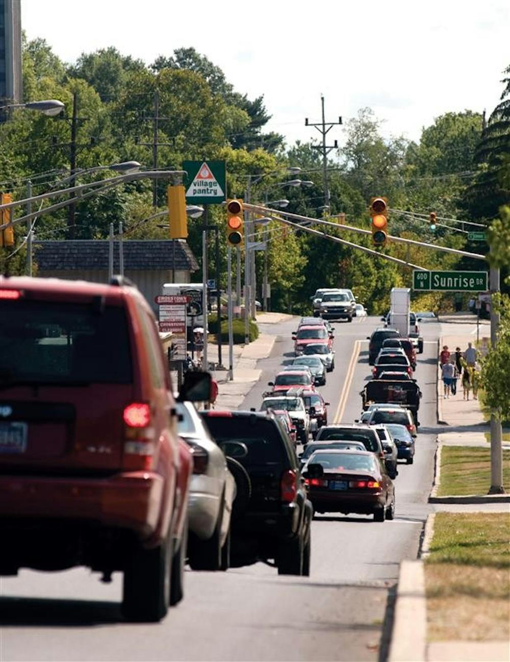 Vehicles slowly flow east on 10th Street on Wednesday near the intersection with Sunrise Drive. Traffic along 10th Street was backed up much of the morning and early afternoon as students and parents made their way to IU for move in day.