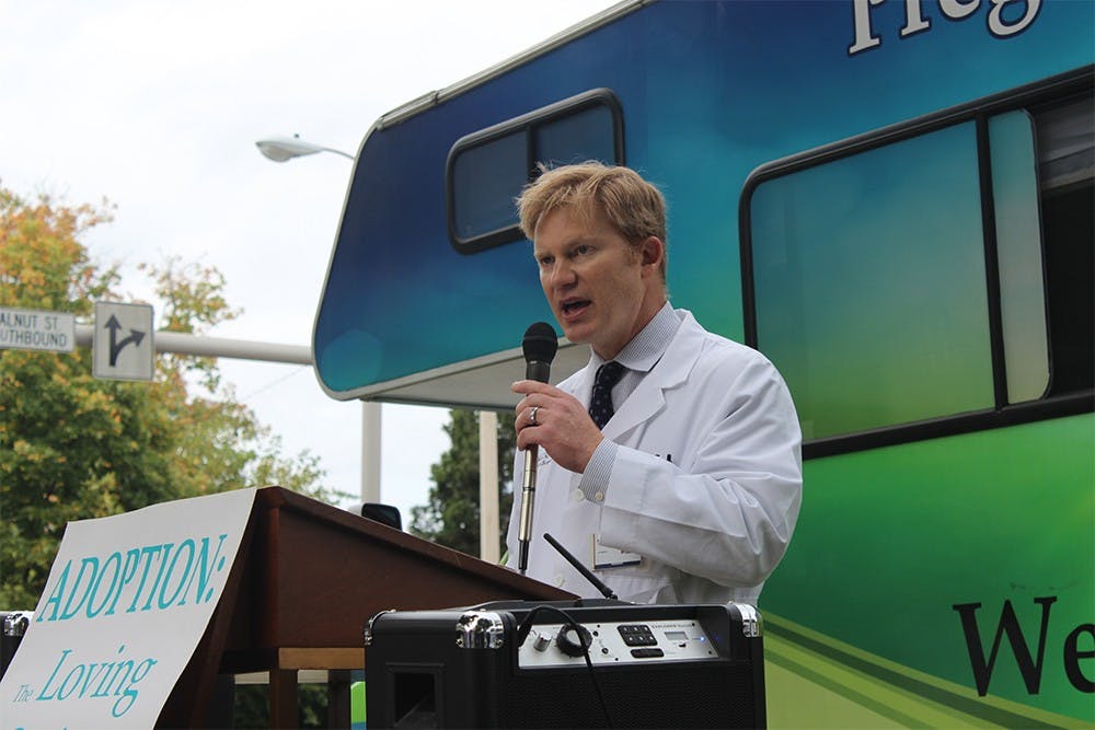 David Hart, a cardiovascular surgeon, speaks during the beginning of a protest against Planned Parenthood on Saturday. Hart was one of the founders of Doctors for Life, which is an group of pro-life doctors.