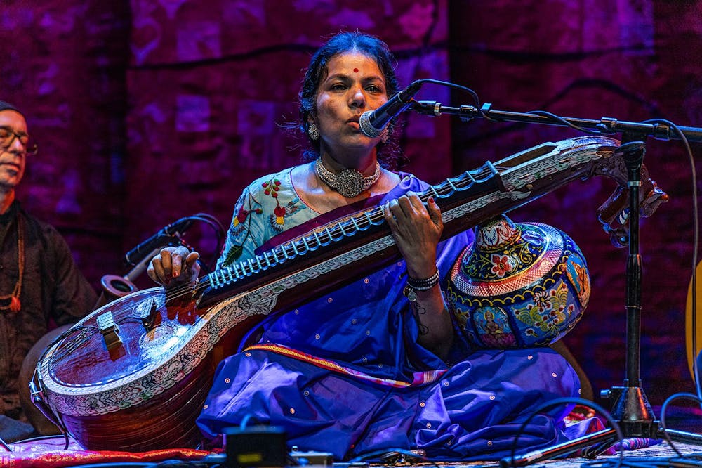 <p>Saraswathi Ranganathan leads the audience through a meditation exercise Sept. 25, 2021, during the Lotus World Music and Arts Festival on the stage of the Buskirk-Chumley Theater. Lotus Education &amp; Arts Foundation will conduct a lineup release party for the annual festival June 29.</p>