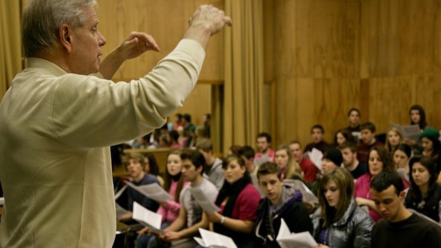 Director of the Singing Hoosiers Michael Schwartzkopf conducts the Singing Hoosiers during practice Wednesday afternoon at the Music Annex. The Singing Hoosiers were invited to sing during the Inauguration events of Barack Obama in Washington D.C. next week.