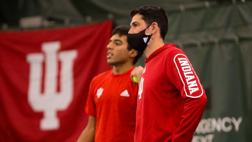 IU head coach Jeremy Wurtzman meets with sophomore singles player Nishanth Basavareddy Jan. 22, 2022, during a home match against Bellarmine University at the IU Tennis Center. Indiana’s 2022 recruiting class was ranked No. 11 in the country by Tennis Recruiting Network on Monday.