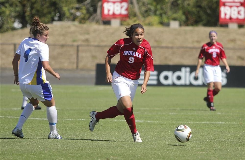 Hofstra's Amy Turner tries to pivot as sophomore Orianica Velasquez dribbles toward the goal during IU's game against the Pride on Sunday at Bill Armstrong Stadium. Velasquez had one shot as the Hoosiers lost 3-1, bringing the team's record to 3-4.