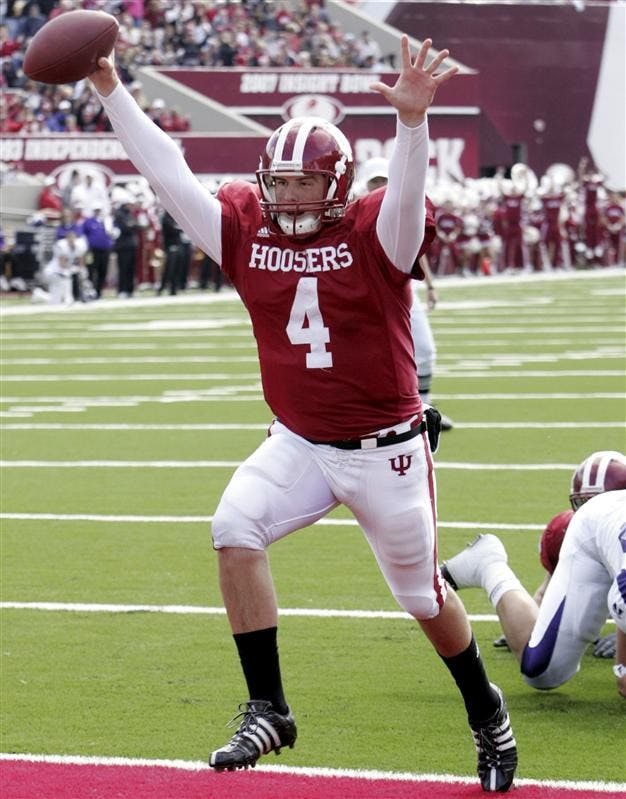 IU quarterback Ben Chappell celebrates as he scores on a 3-yard run during the first half of the Homecoming game against Northwestern on Saturday at Memorial Stadium.