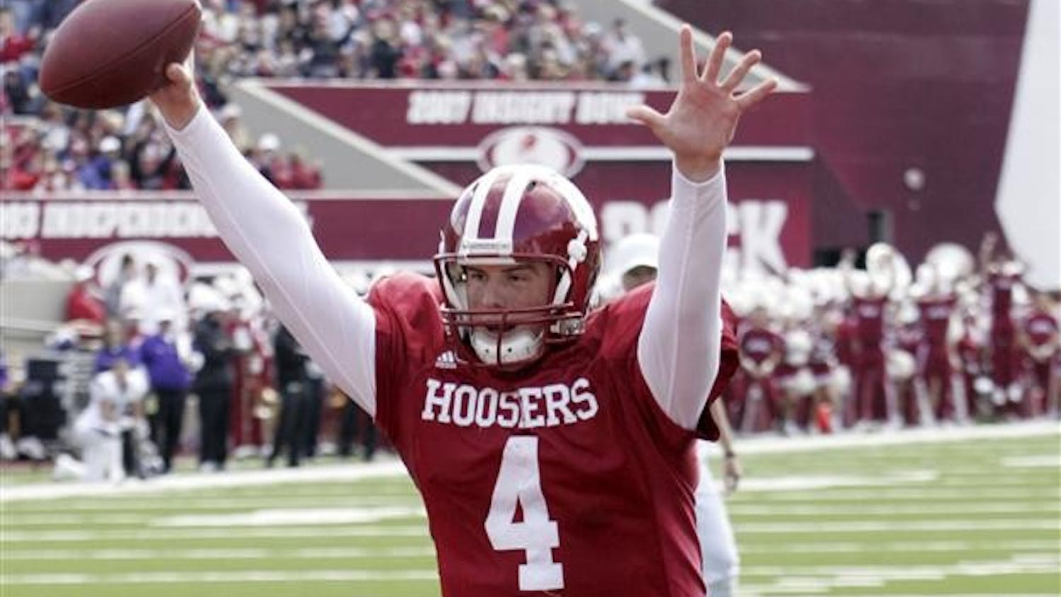 IU quarterback Ben Chappell celebrates as he scores on a 3-yard run during the first half of the Homecoming game against Northwestern on Saturday at Memorial Stadium.