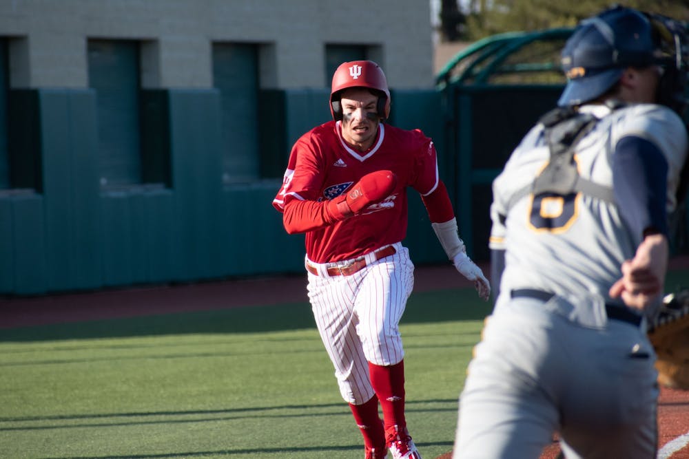<p>Senior shortstop Philip Glasser runs home March 28, 2023, against Kent State at Bart Kaufman Field in Bloomington, Indiana. The Hoosiers beat the Golden Flashes 4-3.</p>