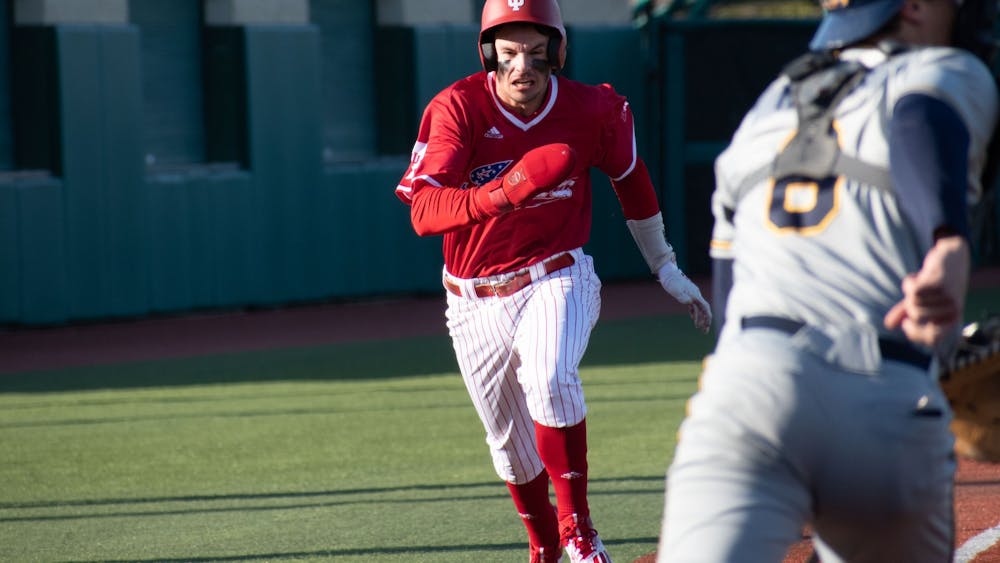 Senior shortstop Philip Glasser runs home March 28, 2023, against Kent State at Bart Kaufman Field in Bloomington, Indiana. The Hoosiers beat the Golden Flashes 4-3.
