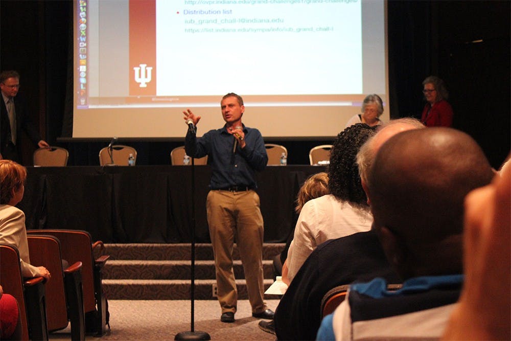 Rick Van Kooten, interim vice provost for research, lays out the plans for IU's Grand Challenges selection process at the open town hall meeting in Whittenberger Auditorium Monday. IU will choose five Grand Challenges proposed by faculty members to strive for in the next five years. 