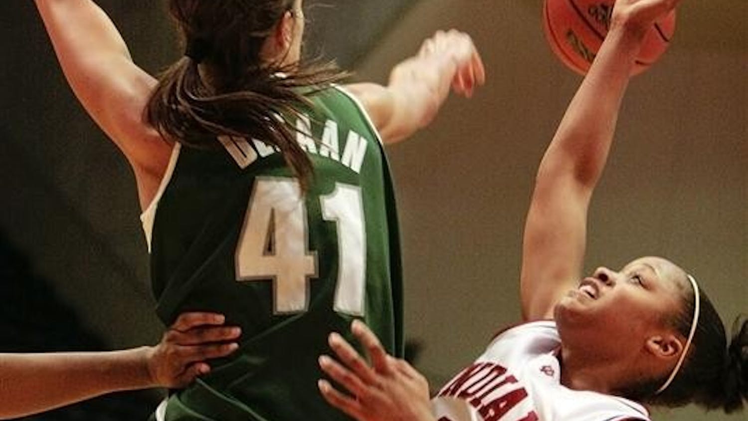 Sophomore guard Andrea McGuirt has her shot rejected by Michigan State's 6-foot-9-inch center Allyssa DeHann during the Hoosiers 71-65 loss to the Spartans February 12 at Assembly Hall.