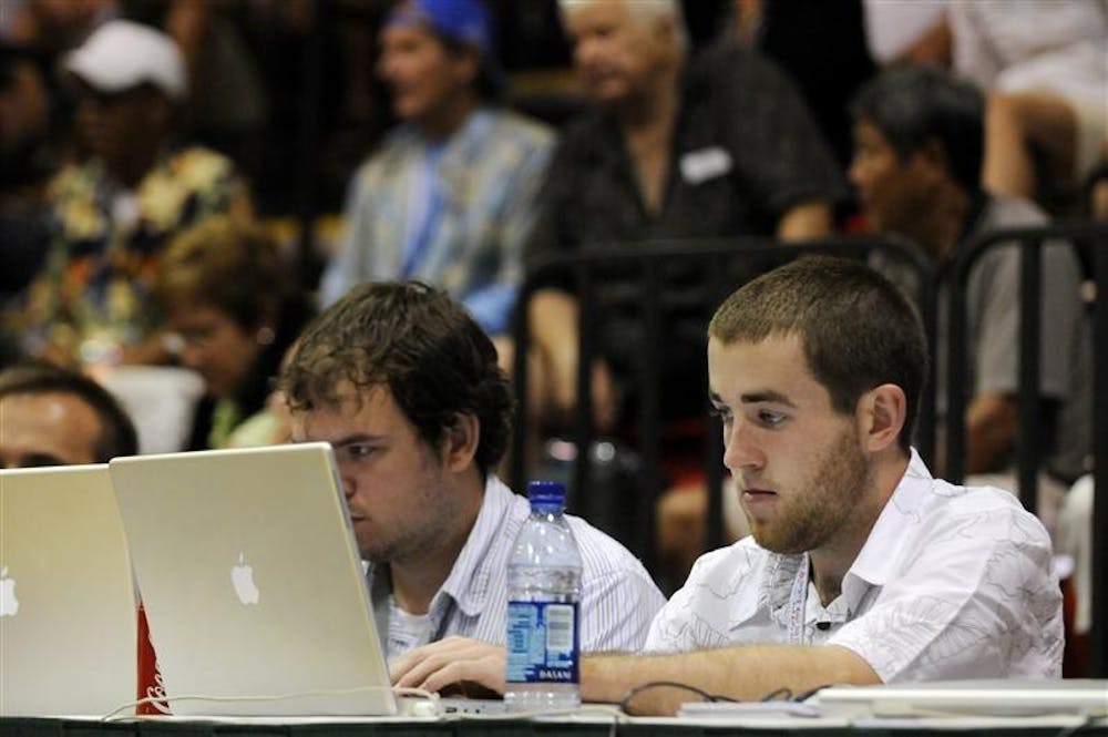 IDS sportswriter Matt Dollinger, right, live blogs with Herald-Times sportswriter Chris Korman during IU's 81-79 win over Chaminade during the EA SPORTS Maui Invitational on Nov. 26 in Lahaina, Hawaii.