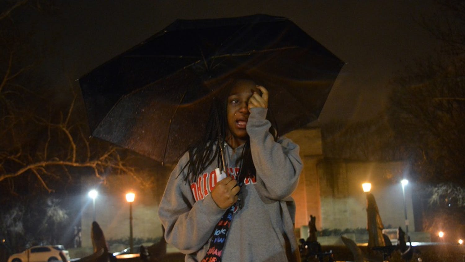 Freshman Alese Allen cries as she recalls fond memories of Djiby. Students gathered at Showalter Fountain to tell others how the c-store worker changed their lives.